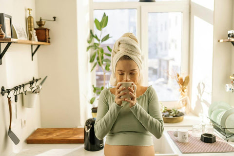 A pregnant woman drinking kava tea