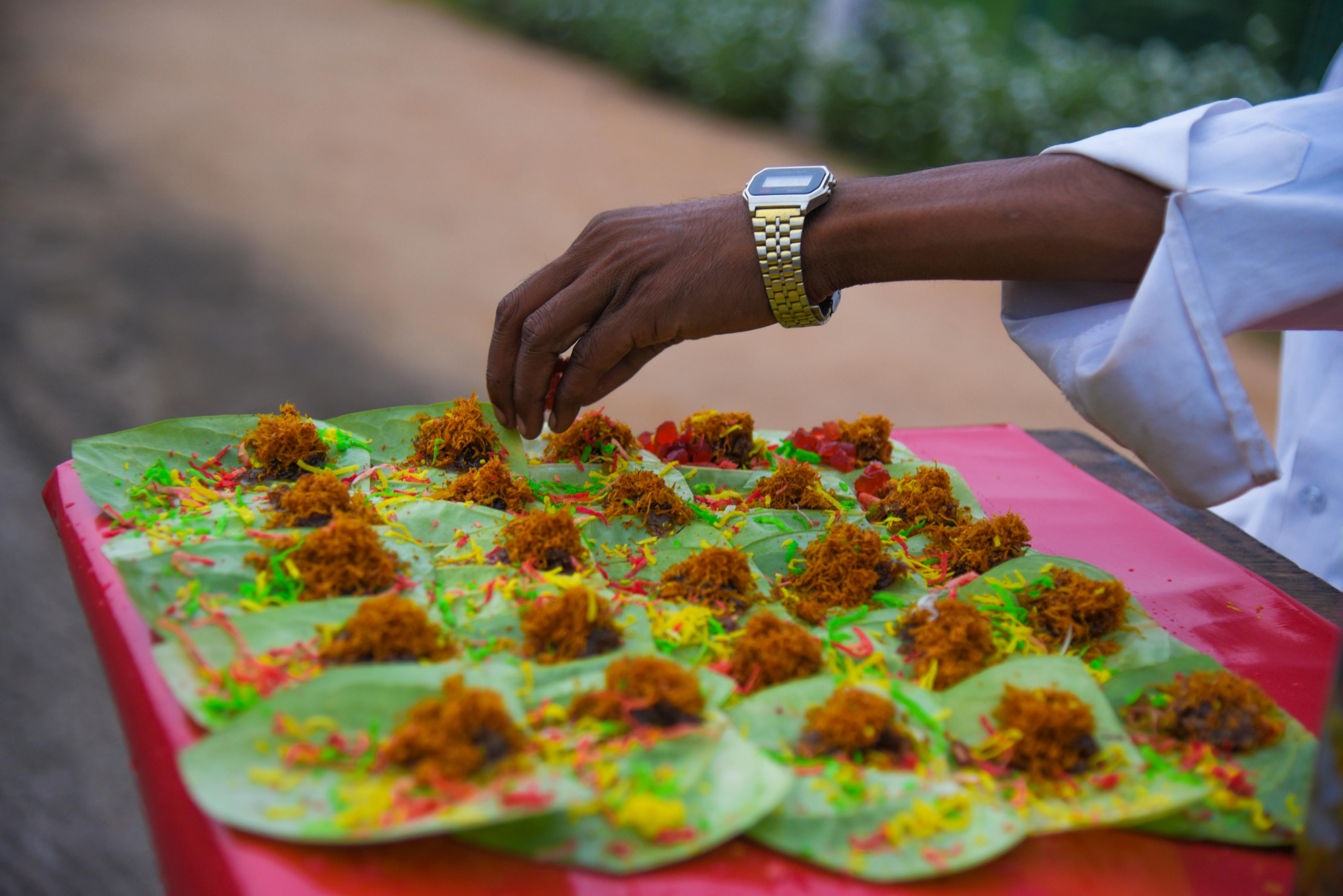 Paan, a traditional mix of betel nut, tobacco, and spices, being prepared